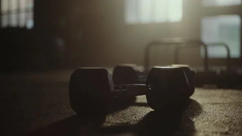 Man lifting dumbbels from floor 스톡 동영상 236179566