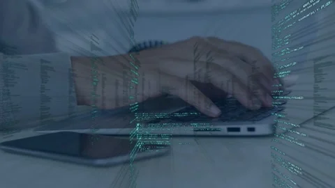 Man lifting hands starting typing on laptop, green code columns expanding around Stock-Footage 335762037