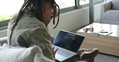 Man is lifting laptop onto lap and opening it, pushing dreadlocks back, Stock Footage 337097008