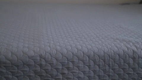Man lifting mattress towards camera 库存影片 125900228