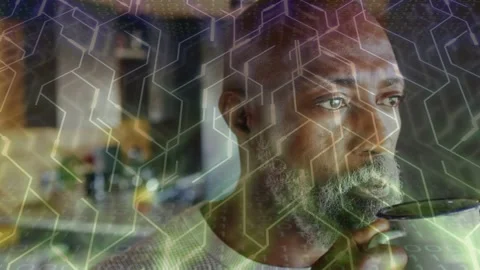 Man lifting mug, sipping and lowering cup, tech hex overlay accenting beard, Stock Footage 333575380