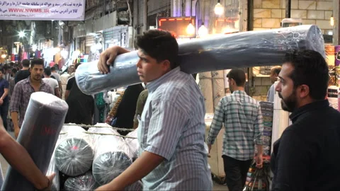 Man lifting an object at the Grand Bazaar, Tehran, Iran, 4K, DNxHR 스톡 동영상 151645255