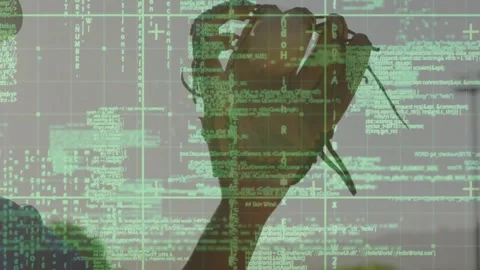 Man lifting rotating glove, starting motion while IT code grid overlay covers Stock Footage 329751265