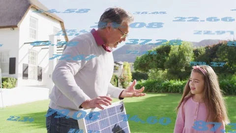 Man lifting solar panel, showing cells, teaching girl solar energy while blue Stock Footage 333950433