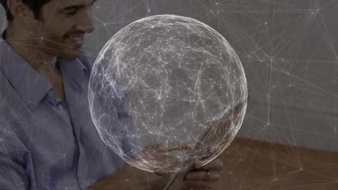 Man lifting tablet and activating pulsing wireframe globe overlay for viewing Stock Footage 317741608