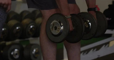 Man lifting weights in gym - close up on hands Stock Footage 148246384