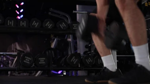 Man lifting weights in the gym Stock Footage 104925864