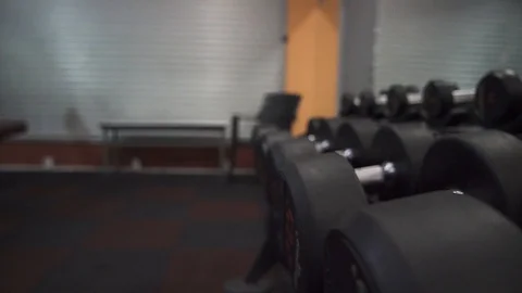 Man Lifting Weights on Gym Stock Footage 129032795