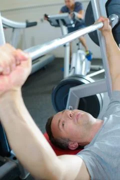Man lifting weights Stock Photos