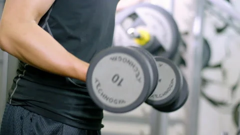 Man Lifting Weights Working Out in Gym Stock Footage 238658340