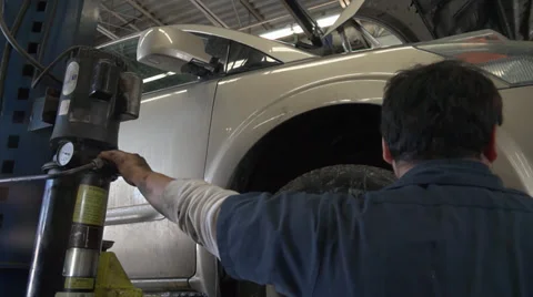 Man lifts a car Stock-Footage 35089980