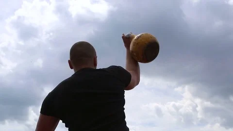 The man lifts the weight. The athlete is pulling weight. Stock Footage 78989072
