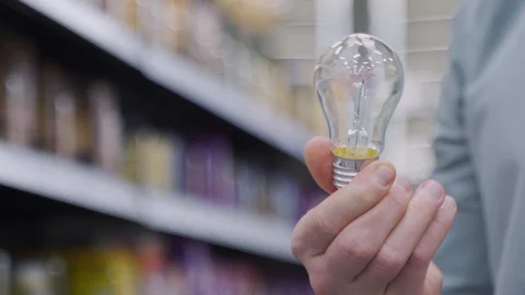 A man with a light bulb 库存影片 121832786