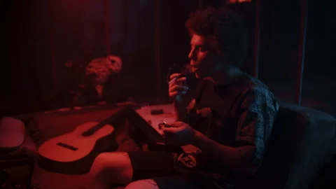 A man lighting up a cigarette 스톡 동영상 258342665