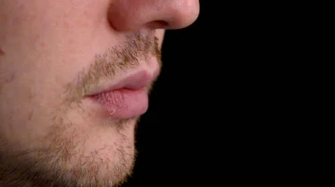 Man lighting a cigarette over black. closeup Video stock 11439050