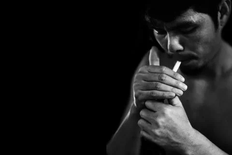 Man lighting cigarette Stock Photos