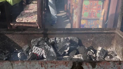Man lighting coals for barbecue, close-up, grill, barbecue, eating out Stock Footage 252126375
