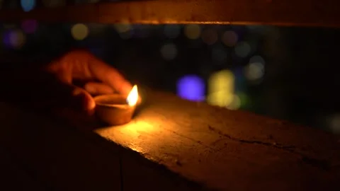A Man lighting  Diya , during Diwali festival india Stock Footage 290167932