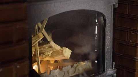 Man lighting fire in a brick stove using a gas lighter Stock Footage 100890000