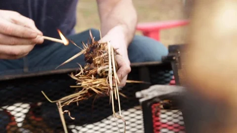 Man Lighting a Fire Stock Footage 121238565