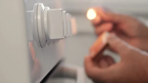 A Man Lighting Up Fire at Gas Cooker Using Matches.  Stock Footage 280359447
