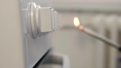 A Man Lighting Up Fire at Gas Cooker with a Lighter. Close-up shooting with a Stock Footage 298891112