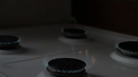 A man lighting the gas stove with a match Stock Footage 72201248