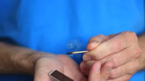 Man lighting a match in a kitchen 動画素材 71954111