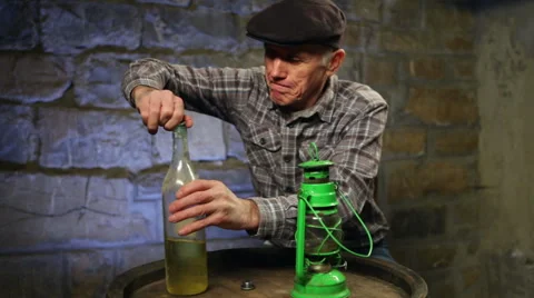 Man lighting up an old oil lamp Stock Footage 45178953