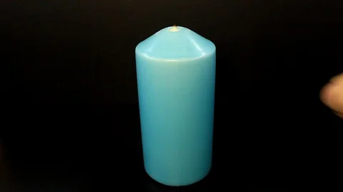 A man lights a candle Stock Footage 86414184