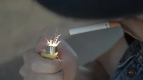 A man lights a cigarette. Stock Footage 51756394