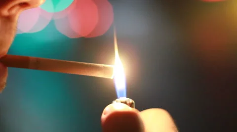 Man lights a cigarette Stock Footage 61724494