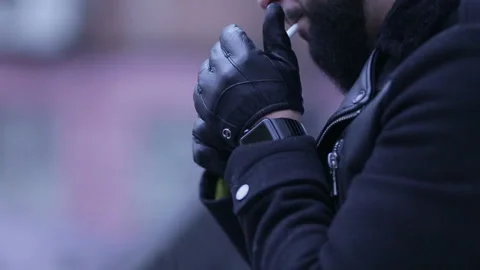 Man lights a cigarette Stock Footage 97453657