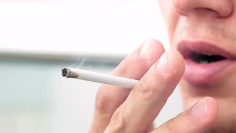 Man lights a cigarette Stock Footage 146775713