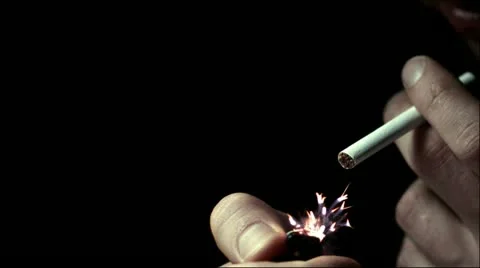 Man lights a cigarette lighter in slow motion Stock Footage