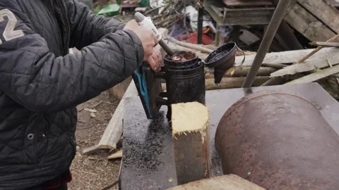 A man lights a device to create smoke Stock Footage 259471074