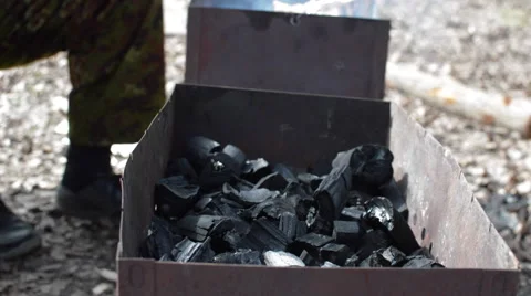 Man Lights the Fire in the Grill Stock Footage 62417757