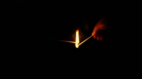 Man Lights Fuse With Match In The Dark Stock Footage 131863048