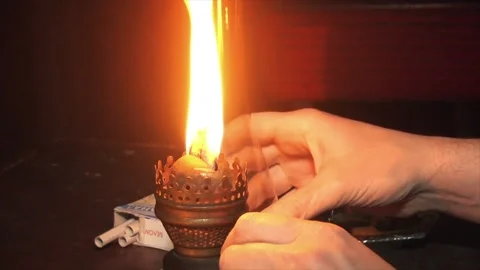 lighting a kerosene lamp