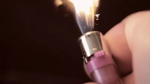 Man lights a lighter Stock Footage 8351288