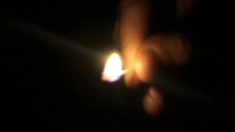 Man lights a match in darkness. Slow Motion 스톡 동영상 77157930