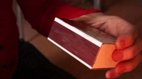 Man lights a match Stock Footage 36235023