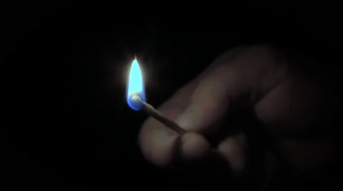 Man lights a match Stock Footage 68386222