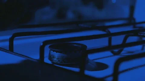 A Man Lights the Match to Light the Gas Stove Stock Footage 62196717