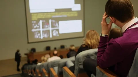 Man listen performance during conference Surgical Stock Footage 299679020