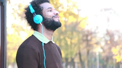 Man listening to music with headphones Stock Footage 59556027