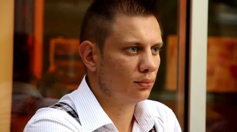 Man listens in cafe Stock Footage 8607777