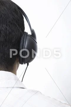 Man Listens To Music, With Earphones