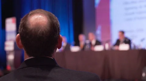 Man listens to panel at a conference Stock Footage 62415519