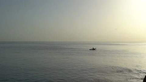 Man in little boat Stock Footage 143371889